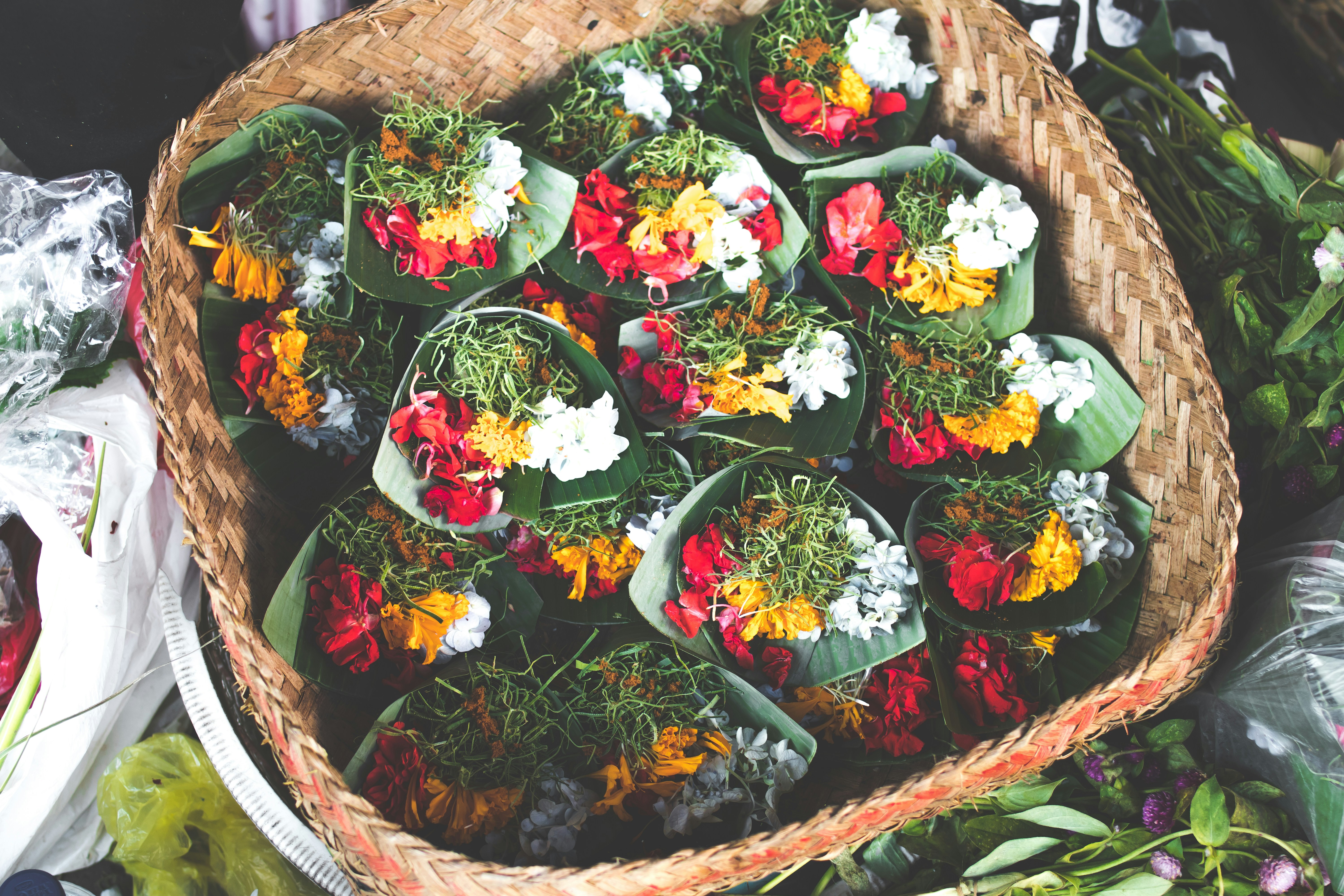 bouquets of flowers in brown wicker basket