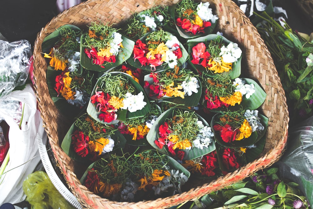 bouquets of flowers in brown wicker basket