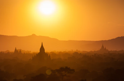 A vibrant sunset over the Golden Triangle where Thailand, Laos, and Myanmar meet.
