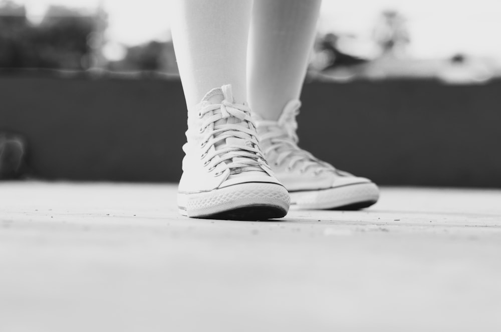 grayscale photography of pair of sneakers