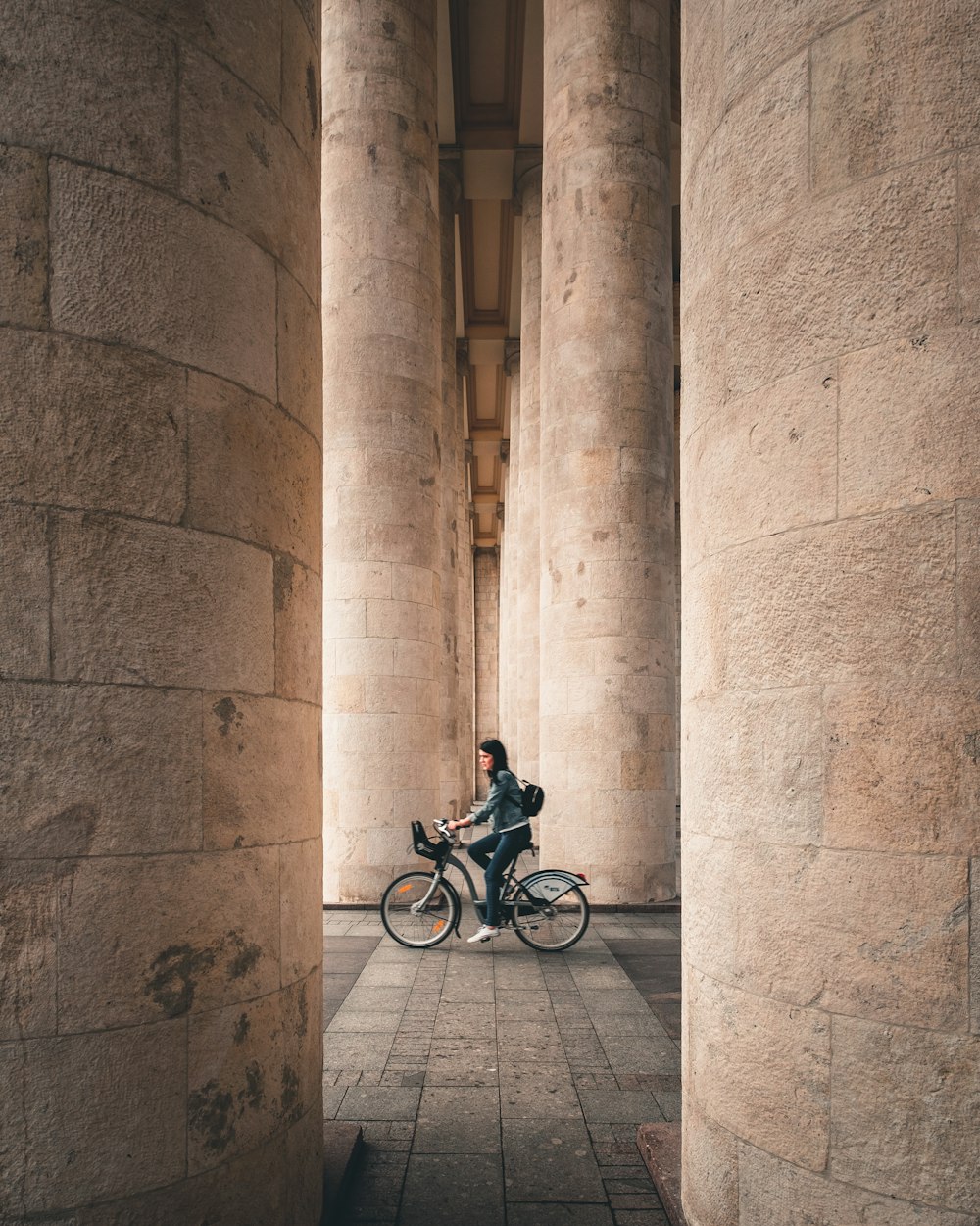 woman biking inside building