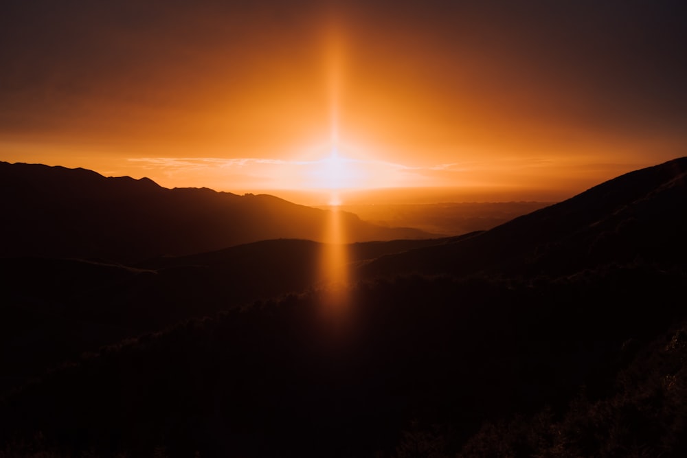 silhouette of mountains during sunset