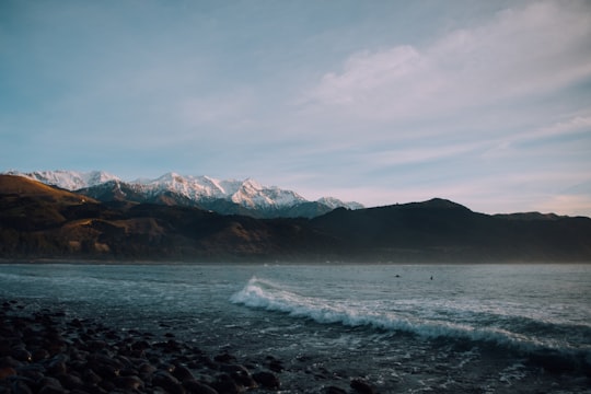landscape photography of mountains and body of water in Kaikoura New Zealand