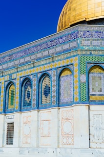 landscape photo of blue, white, and green mosque