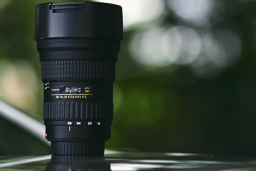 shallow focus photography of zoom lens