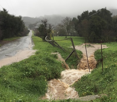 Flooded pathway in a small village in the Amperland region after heavy rain