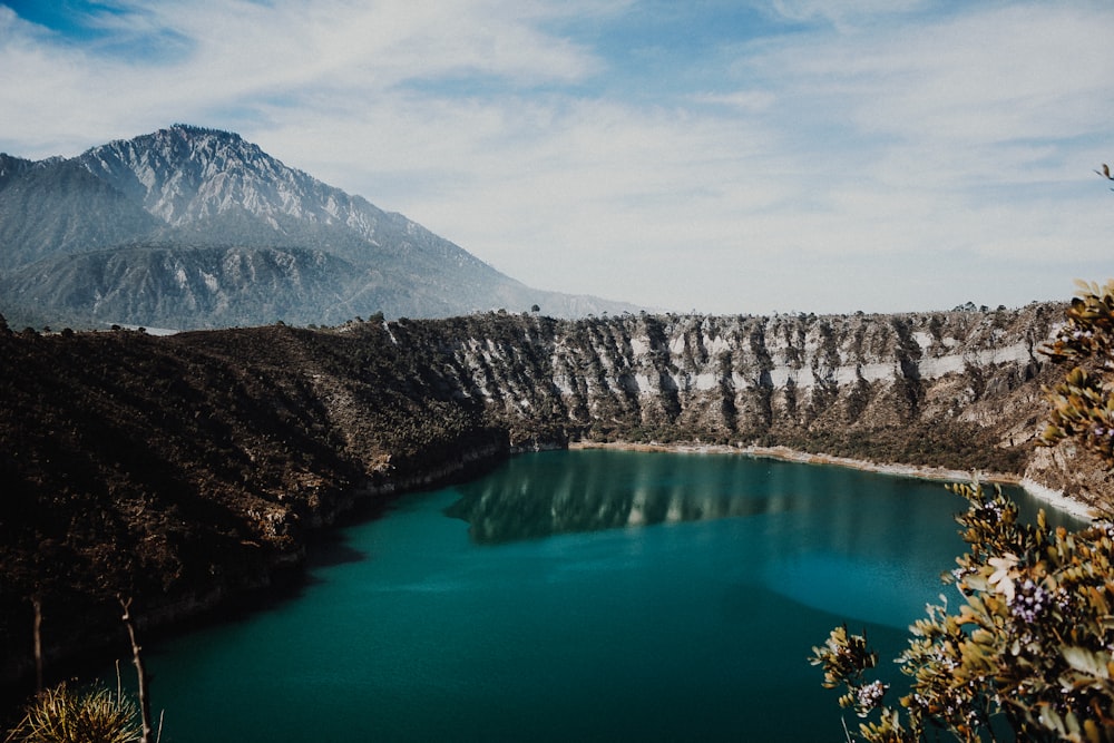 landscape photography of mountains and body of water