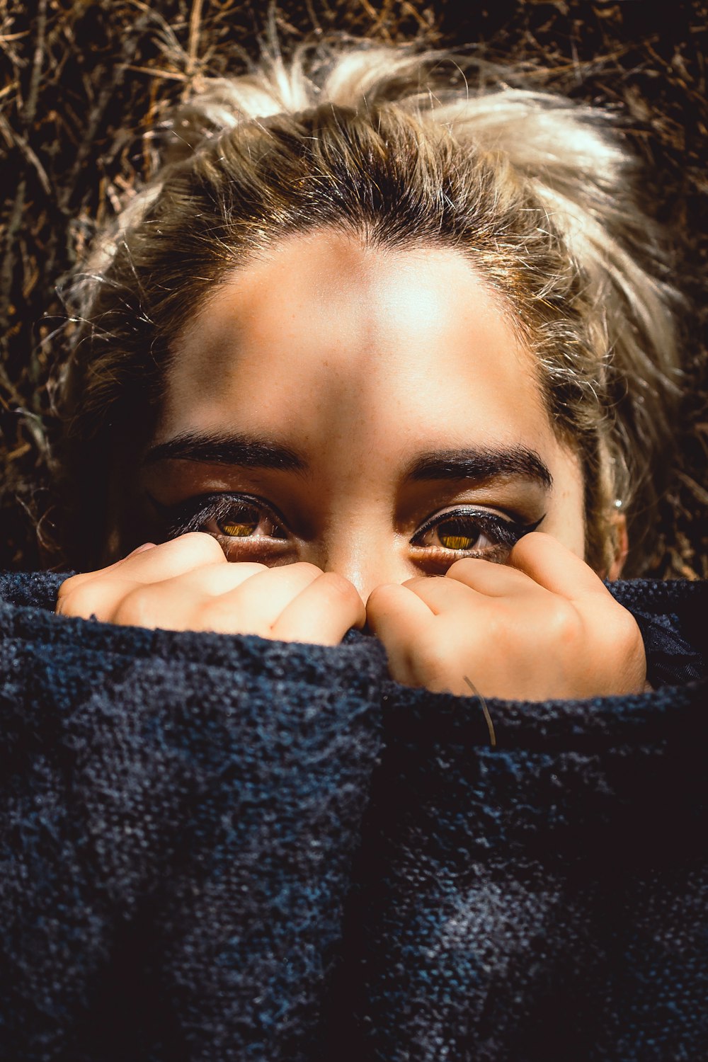 woman covering her face half