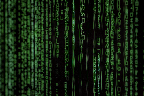 Green code streaming down a display
