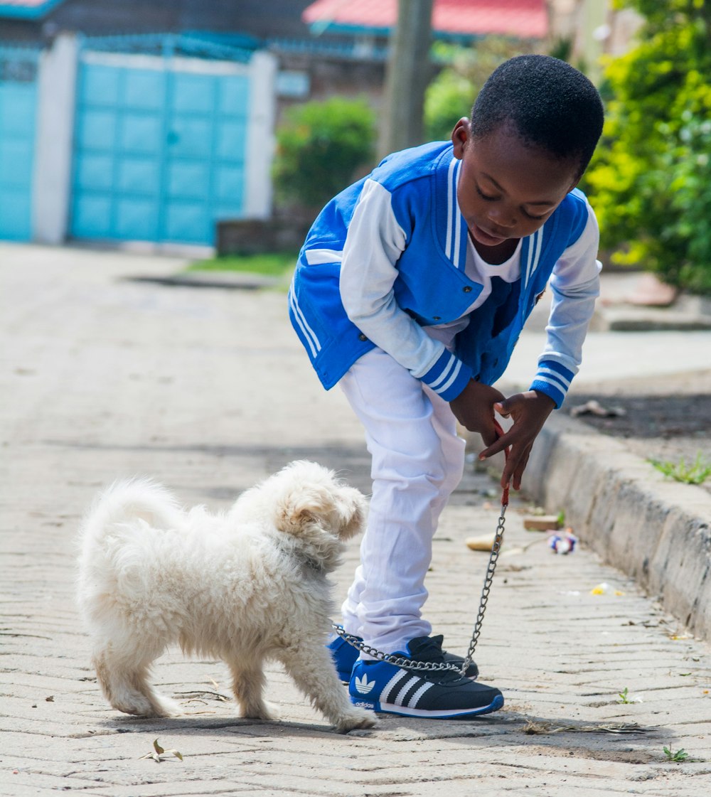 boy taking a walk with dog