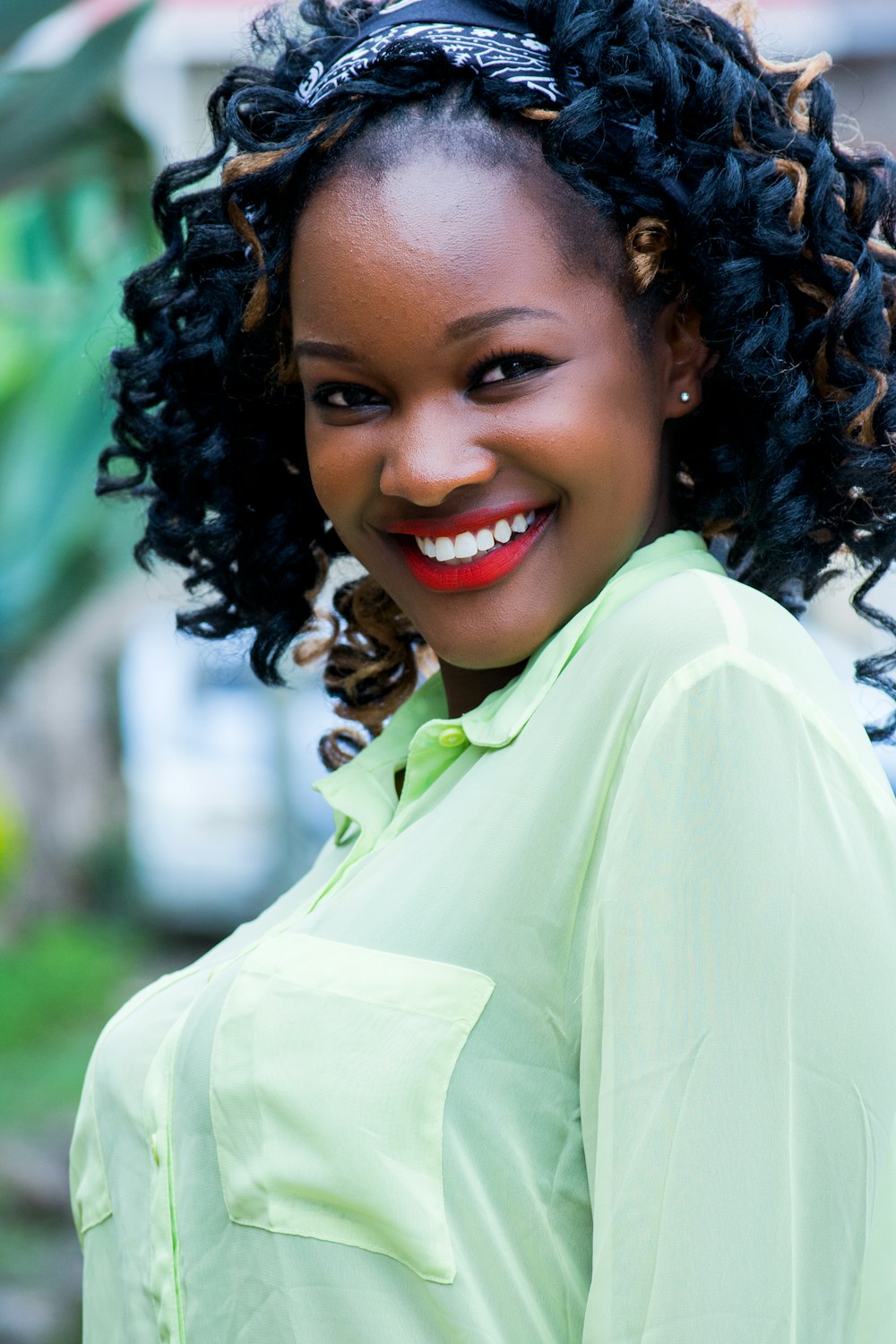 woman wearing green button-up shirt