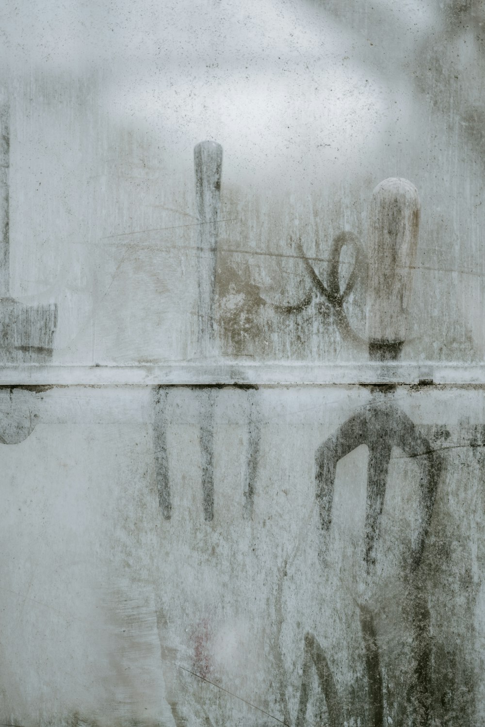 a close up of a window with a reflection of a chair