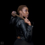 woman posing with brown hand tool