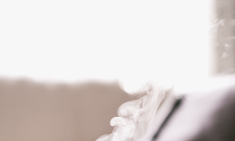 shallow focus photography of hot coffee in mug with saucer