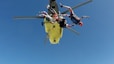 three skydiving people