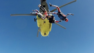 three skydiving people