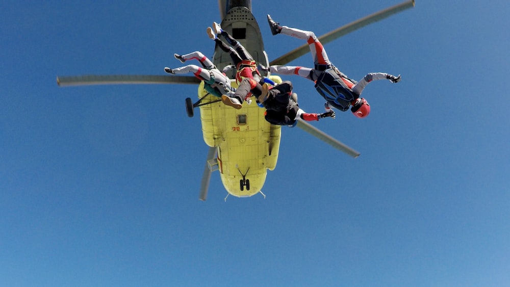 three skydiving people