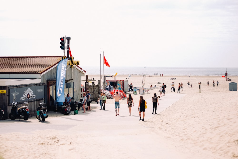 people walking on sand