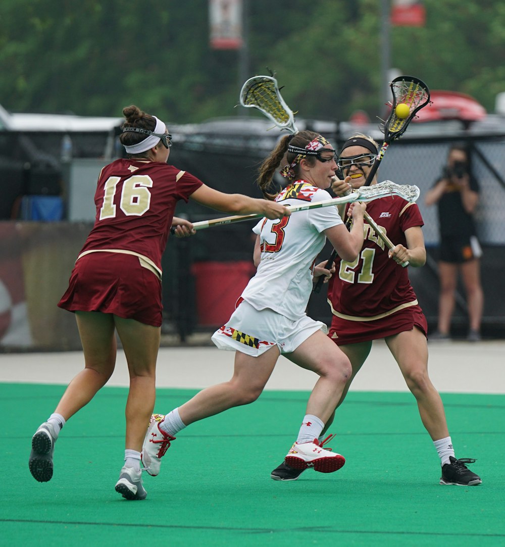 group of woman playing lacrosse