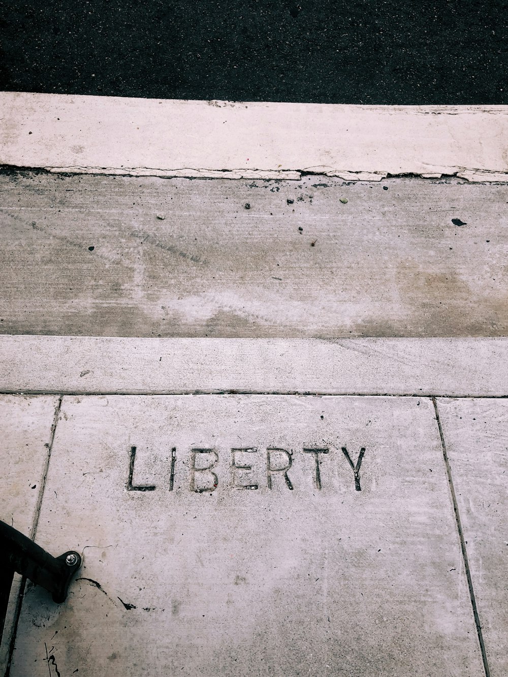 a sidewalk with the word liberty written on it