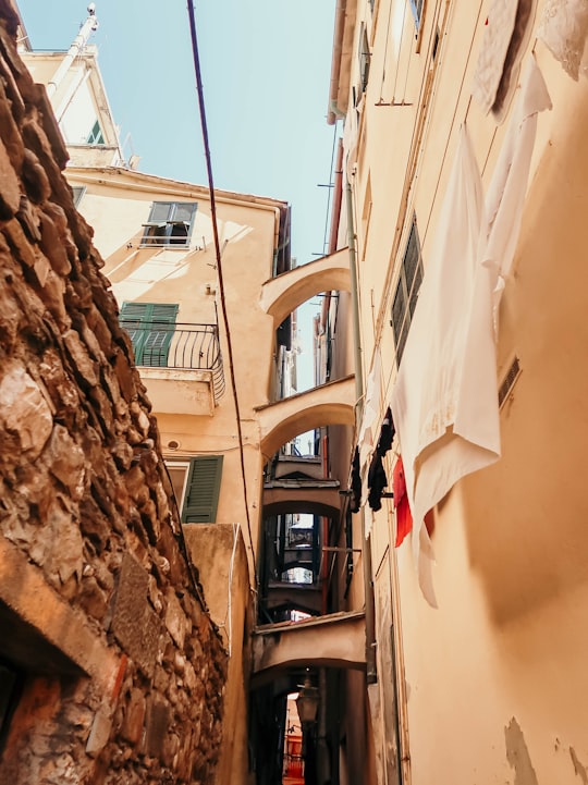 low-angle photography of beige building in Parco Nazionale delle Cinque Terre Italy