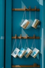 six hanging books on wall