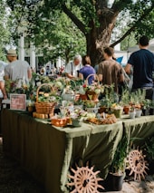 people beside assorted plants on table