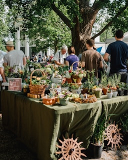 people beside assorted plants on table