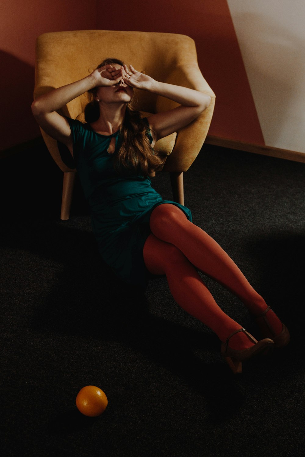 woman leaning on armchair