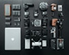 silver MacBook beside battery charger