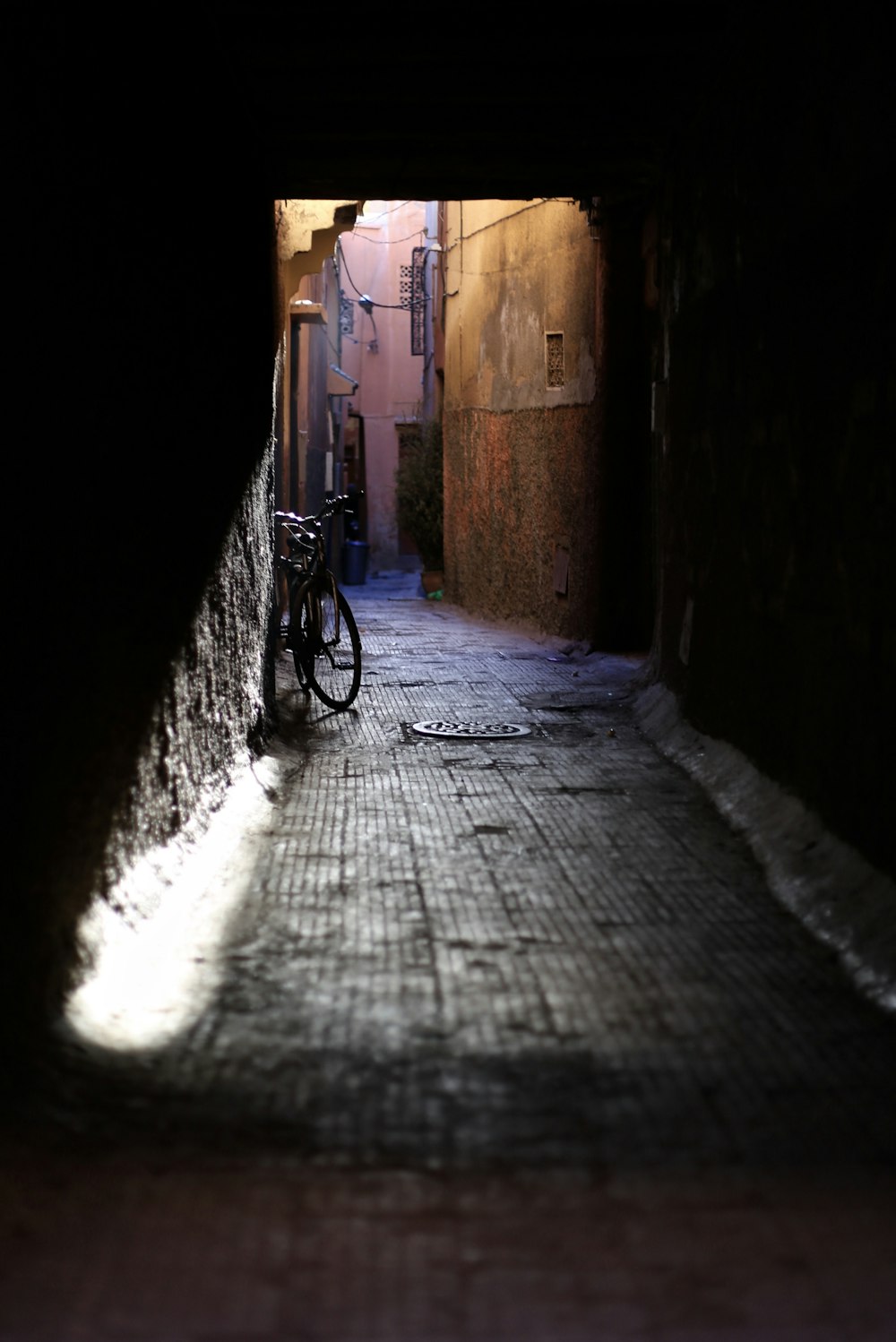 bicycle parked leaning on wall