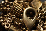 Close-up of a delicate 14k gold filled chain seamlessly micro-welded onto a wrist, bathed in soft golden hour light.