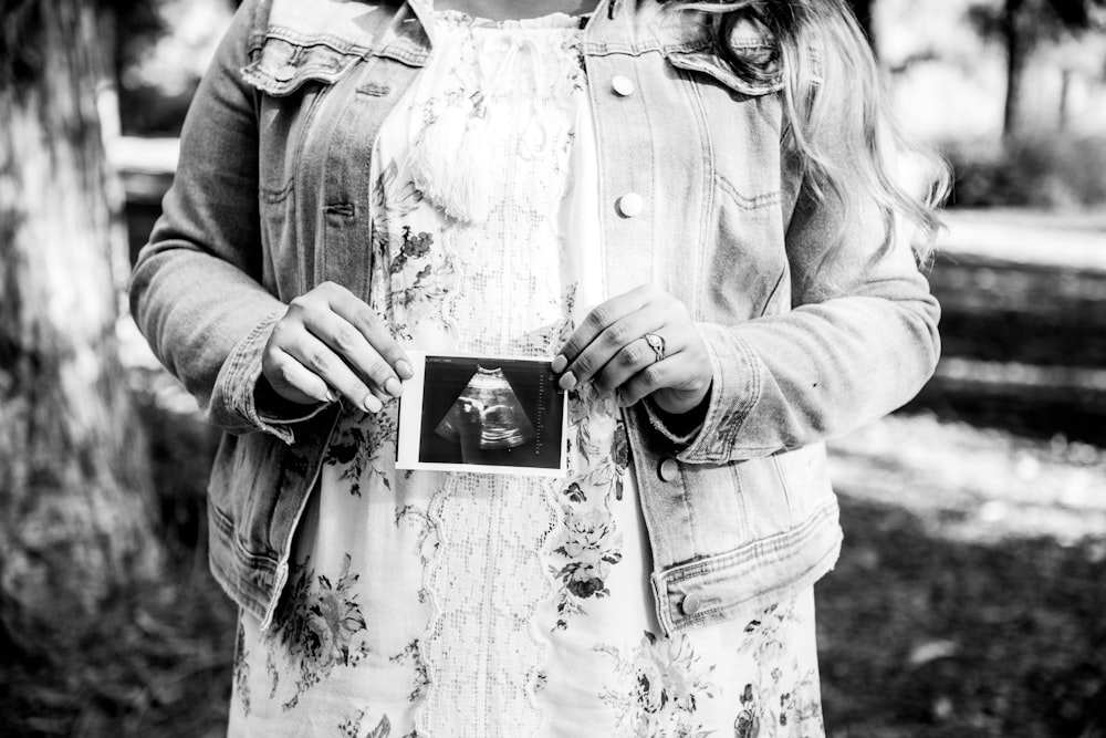 woman holding ultra sound result film