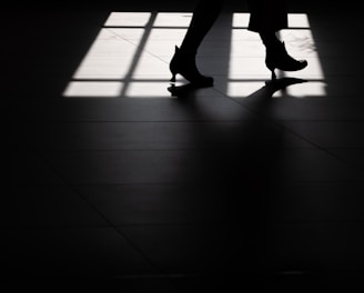 silhouette of person wearing heeled booties