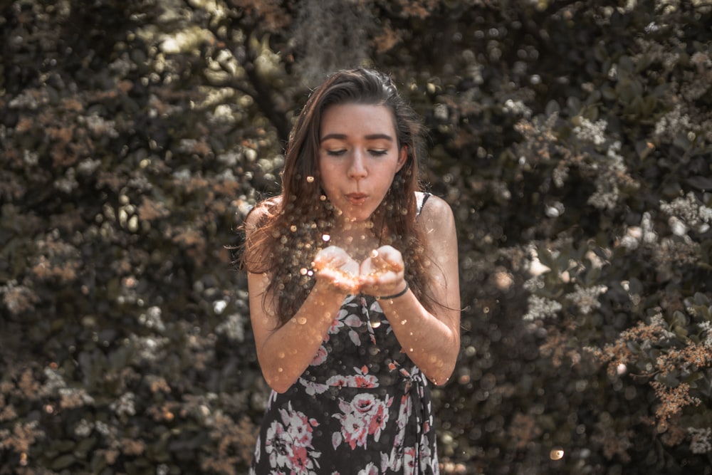 woman blowing her hands