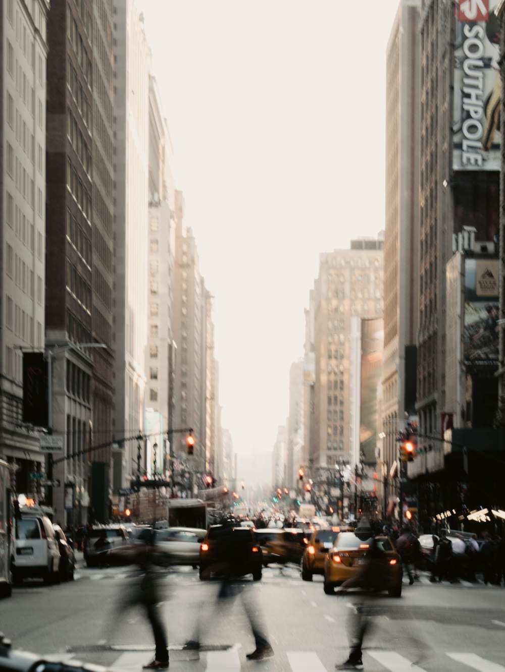 people walking near road between high-rise building during daytime