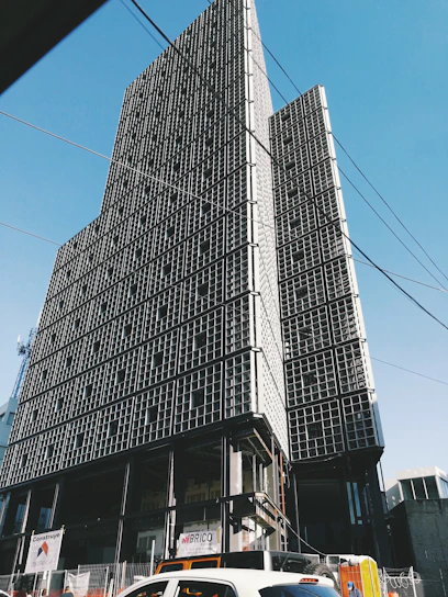Modern prefabricated building under construction with clear blue sky background