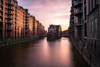 lake view surrounded by concrete building during daytime
