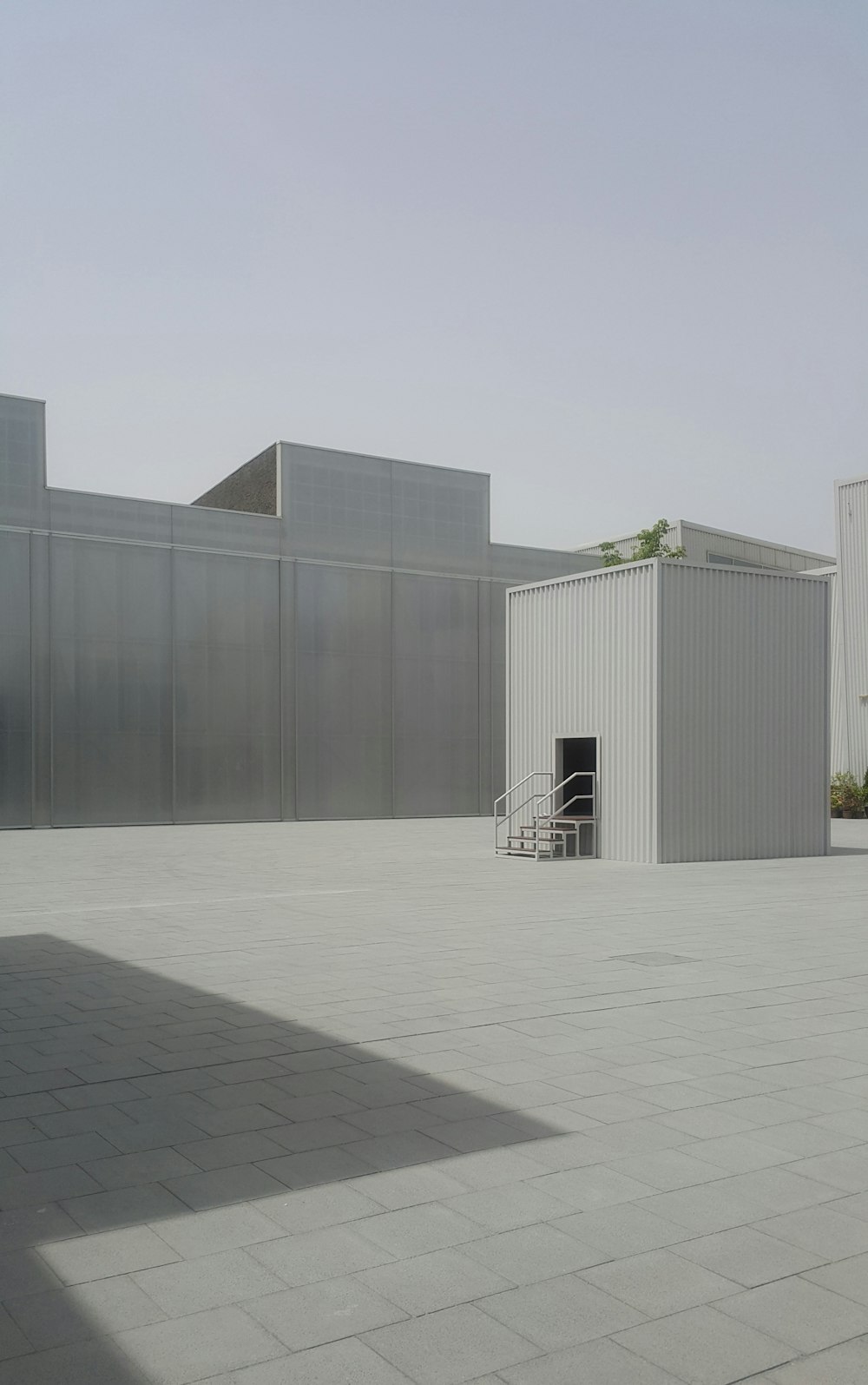 white metal shed near building