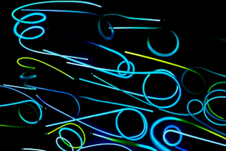 A glowing neural network pattern intertwined with geometric shapes, set against a deep electric blue and neon teal gradient background.