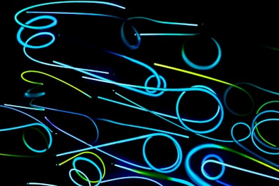 A sleek, abstract anime-style digital network pattern glowing in blue and gray hues.