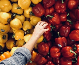 person holding bell pepper
