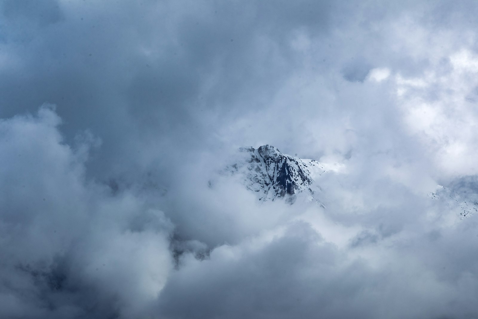 Canon EOS-1D Mark IV + Canon EF 70-200mm F2.8L IS II USM sample photo. Mountain covered by clouds photography