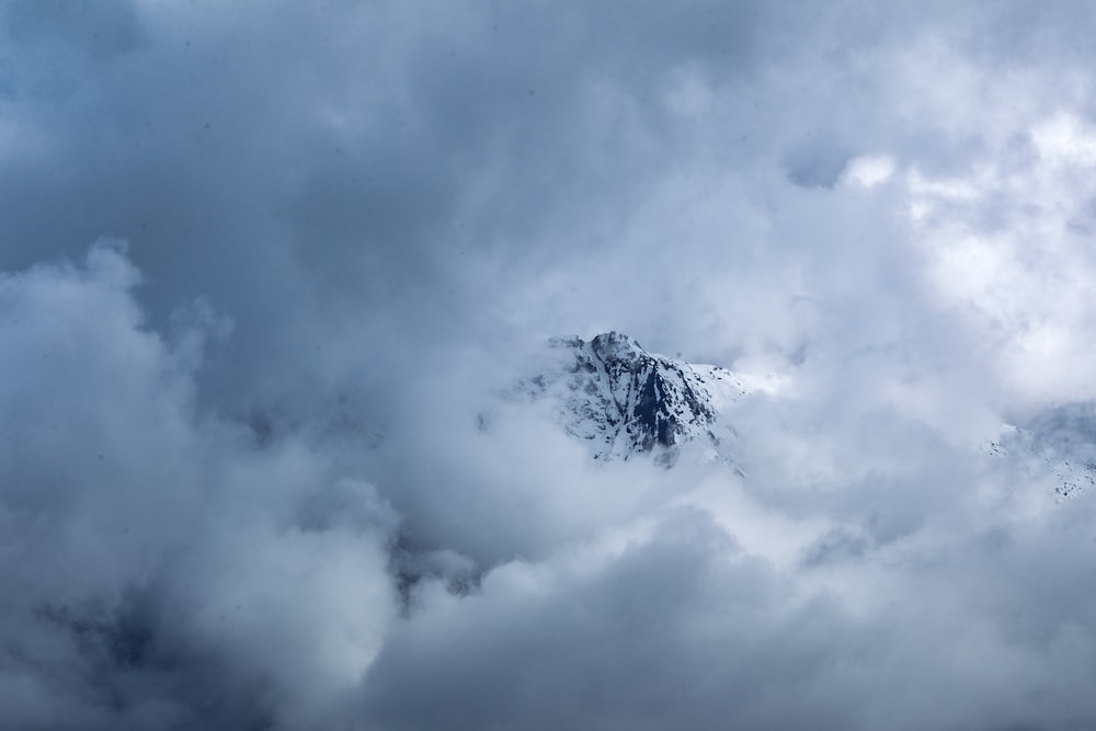 mountain covered by clouds