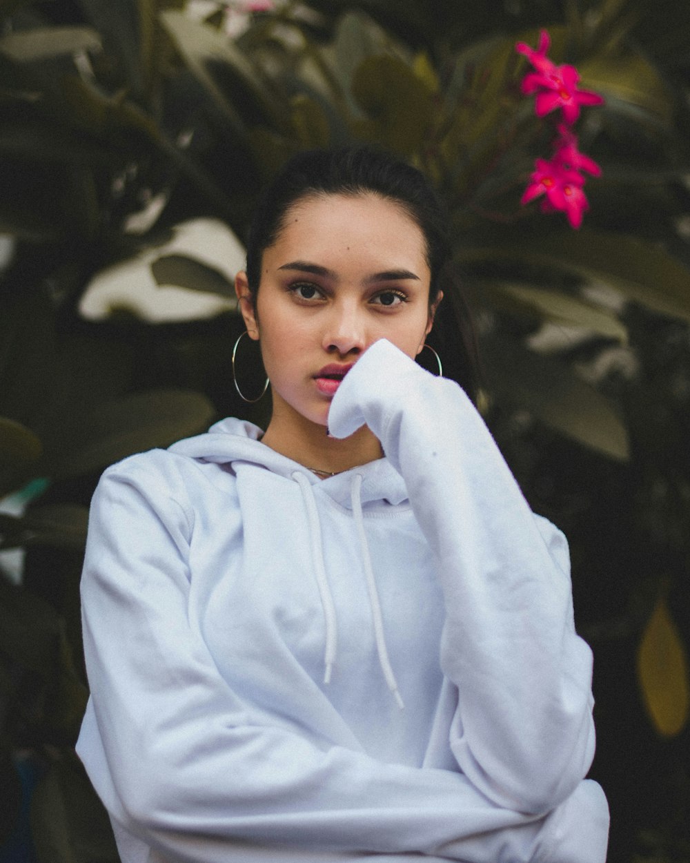 portrait photography of woman in white pullover hoodie