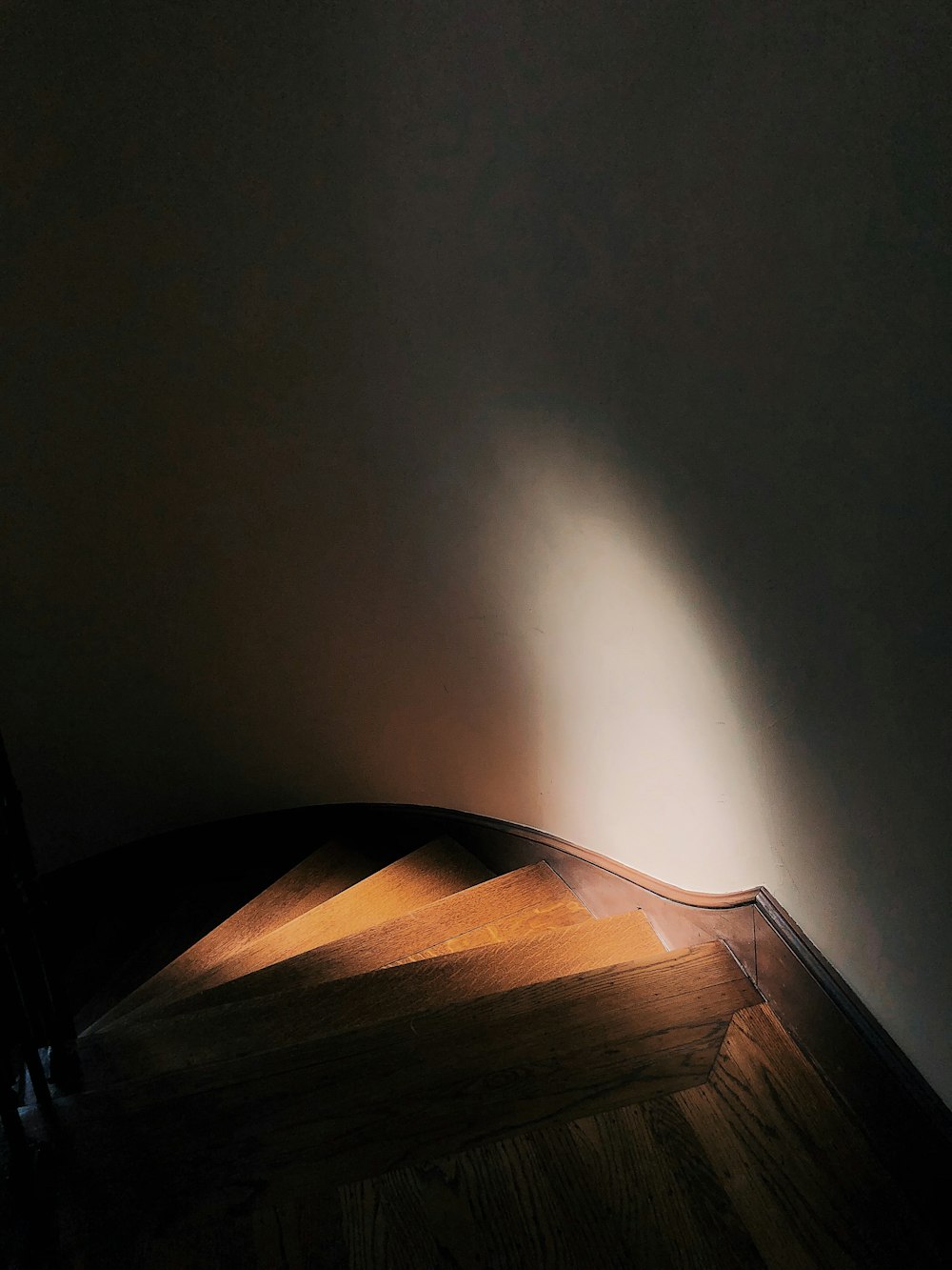 low light photo of wooden staircase