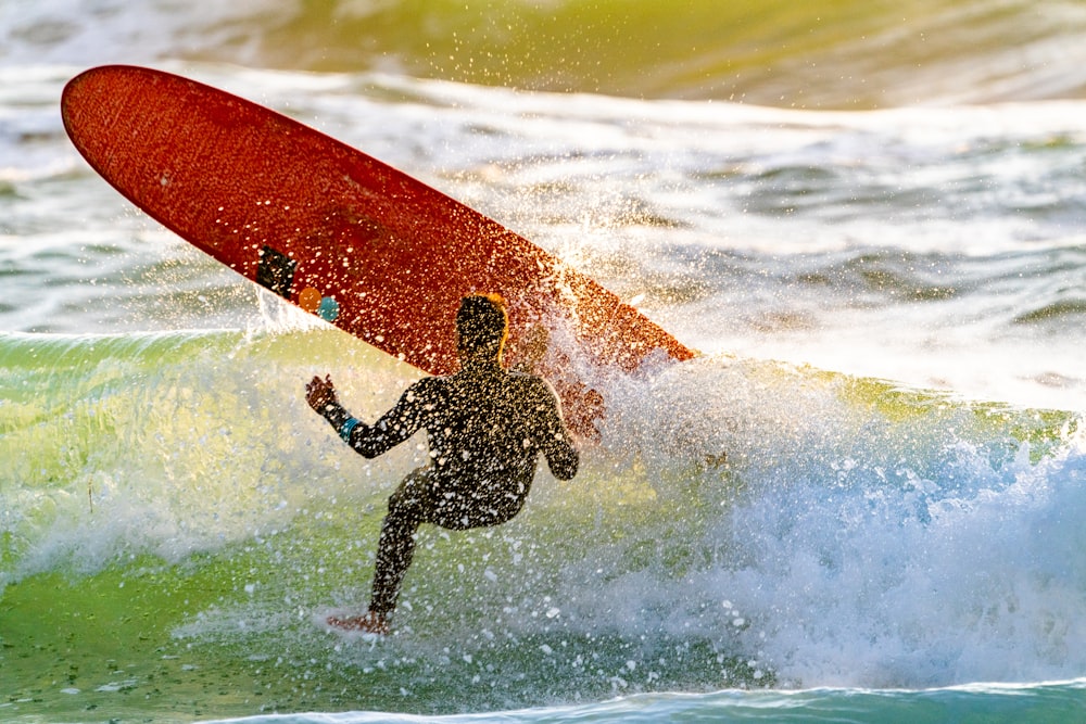 surfer bailing out on board