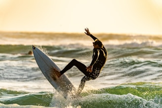 shallow focus photography of man surfing