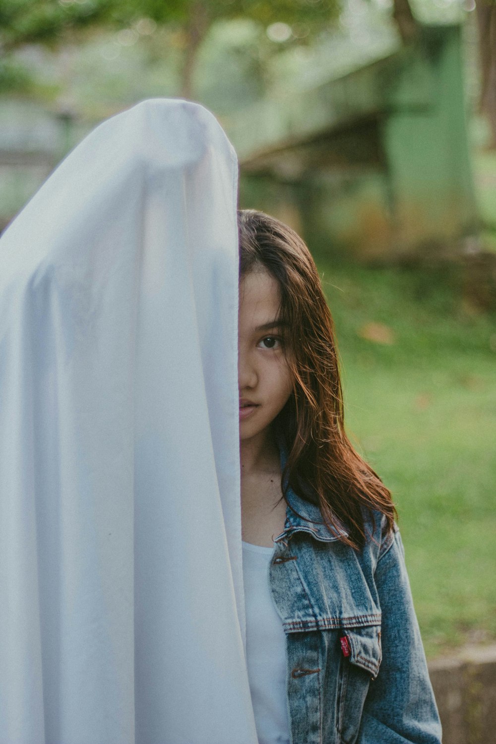 woman covered half of her face with cloth