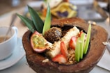 A refreshing fruit sorbet served in a coconut shell.